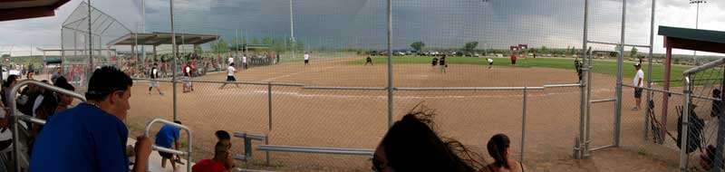 Nothing stops softball, not even an approaching thunderstorm and high wind