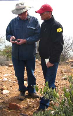Dale shows Ralph how to use a GPS to find a Geocache