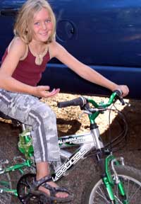 Courtney rides a bike