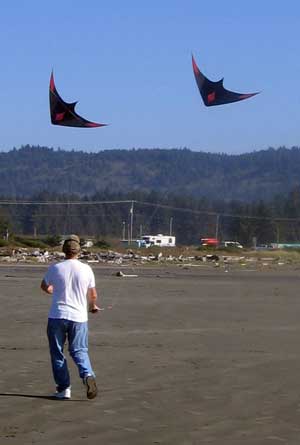 Gary flying two kites at the same time