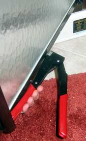 Pop rivet plier is used to secure rivets to bottom of shower door