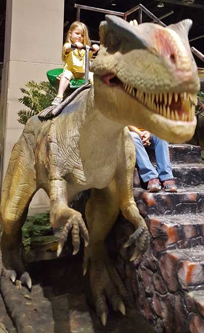 Lucy riding a dinosaur