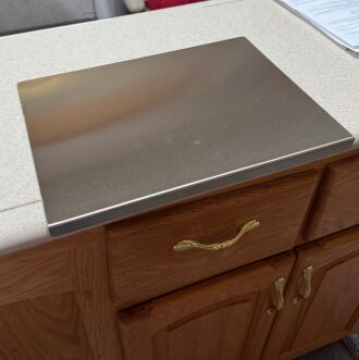 I added a stainless steel cutting board to my kitchen