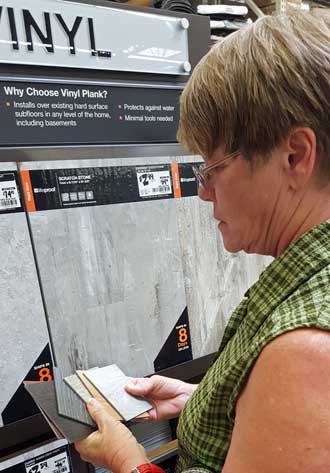Gwen is picking out free samples at Home Depot