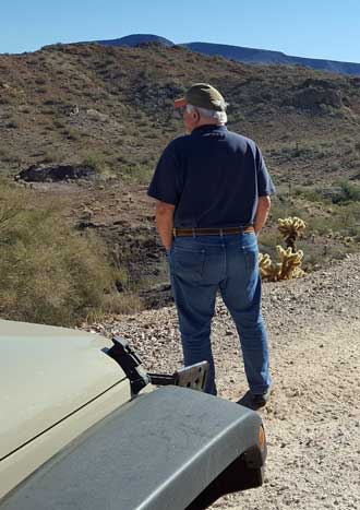 Gary surveys the desert road