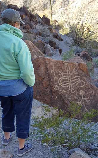 Gwen discovers the first petroglyph