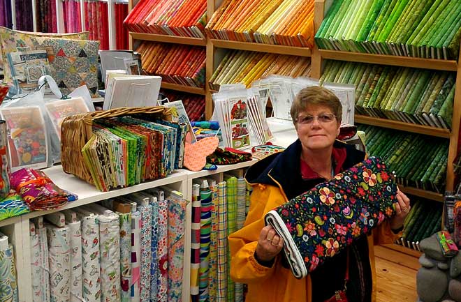Gwen visits the Stitch'n Post Quilt Shop, Behind: view of the Beacham's Clock Shop