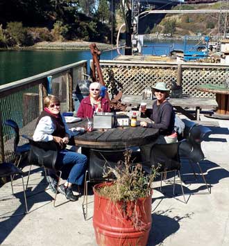 Lunch at the 4 star Sea Pal Cove on the harbor in Fort Bragg, Behind: Dorana makes a joke about our numbered order. 