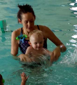 Noah getting a swim lesson, Behind: before floating on his back