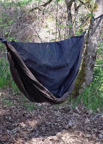 Trying the Hennessy Hammock for the first time, Behind: installing the tarp