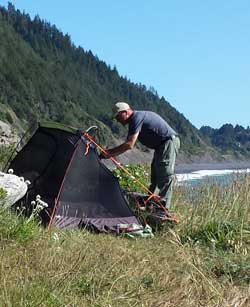 Lane sets up his tent about 1.5 miles from where the shultle will pick us up, Behind: Katchen get a warm rock message