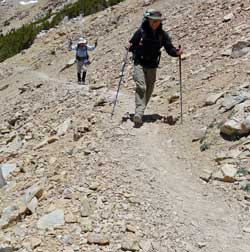 Merle and Katchan hiking down toward the JMT: Behind: on the trail before reaching the JMT