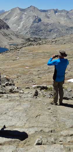 Merle photographing the north side of Pinchot Pass, Behind: A view of Margorie Lake to the north
