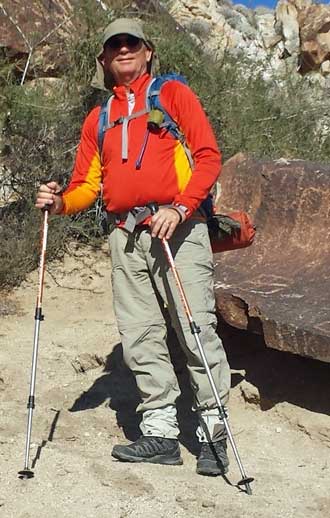 Dressed warmly to start the hike, Behind: Entrance to canyon marked with petroglyphs on both sides of the canyon
