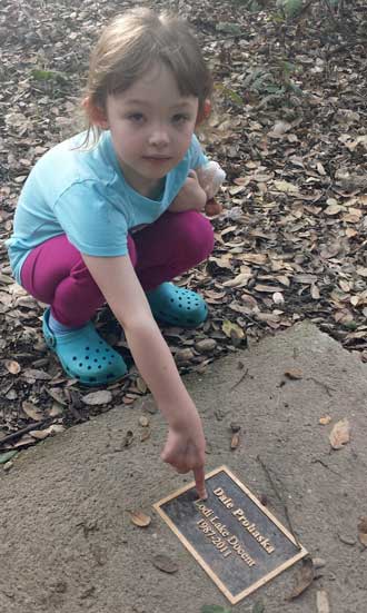 Chloe found great grandpa's bench in the Lodi Nature Area