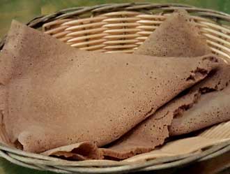 Injera is used to scoop the meal from the common plate