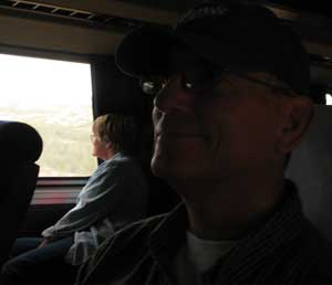 Mindy took this photo of me sitting on her side of the train while Gwen sat alone on the scenic side of the train.