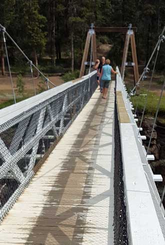 Gwen crossing the Miles Canyon suspension bridge. 