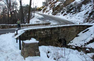 A narrow single lane bridge on the north slope on the climb to the summit