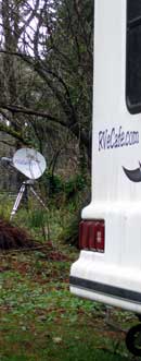 The dish is located about 60 feet from the trailer