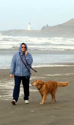Walking Agate Beach with Yaquina Head Lighthouse in the distance