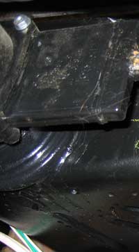 Area of cracks, drips are from glue used to secure the valve.