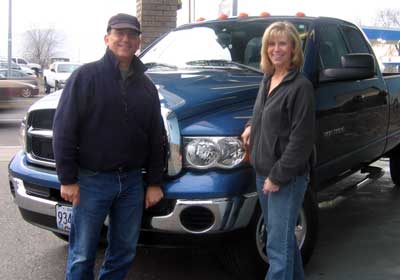 Anita and Dale in front of the repaired truck